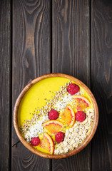 Smoothie bowls. Healthy breakfast bowl with chia seeds, muesli, berries, fruits and coconut flakes coconut flakes. Vegan food