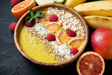 Smoothie bowls. Healthy breakfast bowl with chia seeds, muesli, berries, fruits and coconut flakes coconut flakes. Vegan food