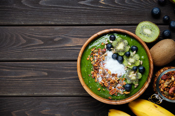Smoothie bowls. Healthy breakfast bowl with chia seeds, muesli, berries, fruits and coconut flakes coconut flakes. Vegan food