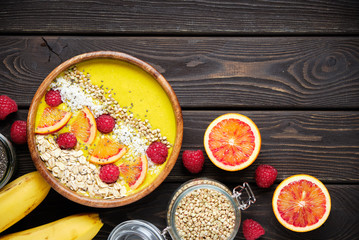 Smoothie bowls. Healthy breakfast bowl with chia seeds, muesli, berries, fruits and coconut flakes coconut flakes. Vegan food