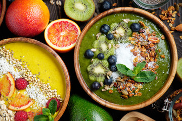 Smoothie bowls. Healthy breakfast bowl with chia seeds, muesli, berries, fruits and coconut flakes coconut flakes. Vegan food
