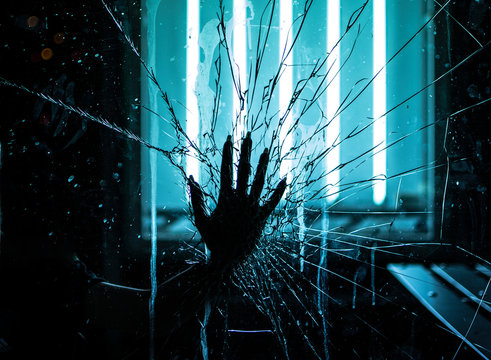 hand breaking glass