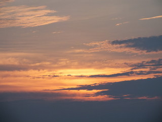 The sky is beautiful. With red, blue and clouds floating down the white color