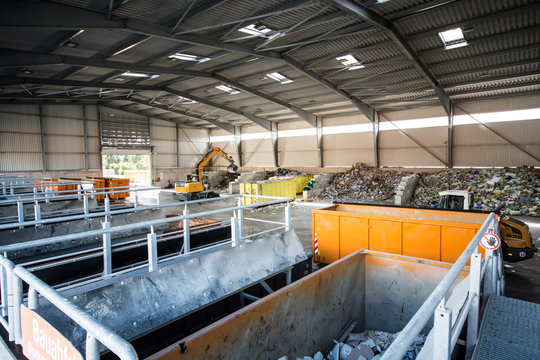 waste is sorted and disposed of at a recycling yard - Powered by Adobe