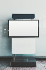 Mock-up of an advertising LCD screen desk indoors of a shopping mall; a vertical template of a...