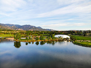 Fototapeta na wymiar Lake and Mountains Golf Course Aerial 