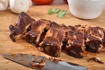 Sliced barbecue ribs on a cutting board