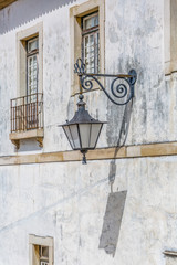 View of retro public street lamp, in street of the city of Coimbra, Portugal