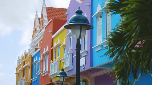 Slow motion shot revealing the unique and colourful facades of the dutch buildings in downtown Kralendijk, Bonaire, in the Caribbean