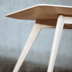 Mid century wood table in concrete interior 3d render