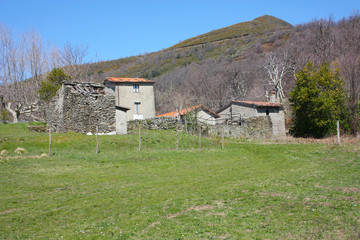Fototapeta na wymiar abandoned village and empty solitary houses. green lawn on a sunny spring day in Cerreta San Nicola