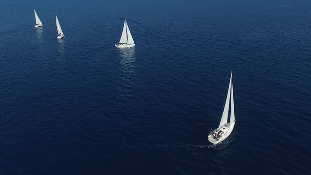 Sailing boats round the mark by participating in the competition, aerial view