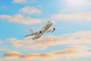 Flying climb altitude traveling, sunset sun glare in the evening voyage airplane.