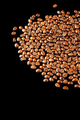 coffee beans isolated on black background op view