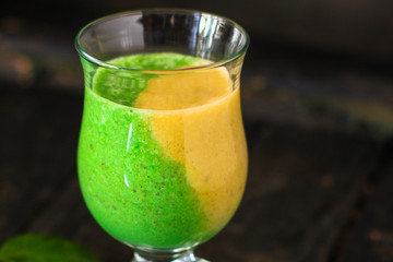 Smoothies, banana, basil, spinach, chia seeds and more healthy food concept. food background. top view