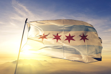 Chicago city of United States flag waving on the top sunrise mist fog