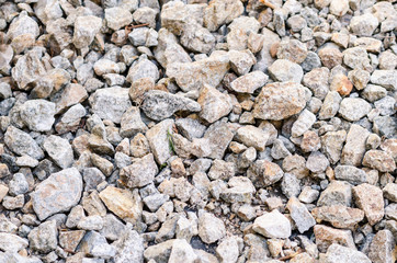  Rubble stones on the ground as a background