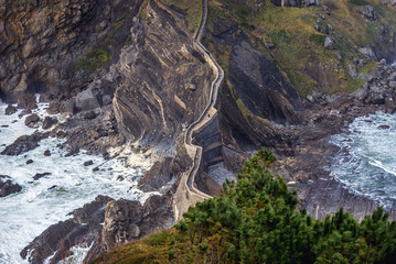 Aerial view on a manmade bridge to Gaztelugatxe islet with hermitage of St John on the top in Spain