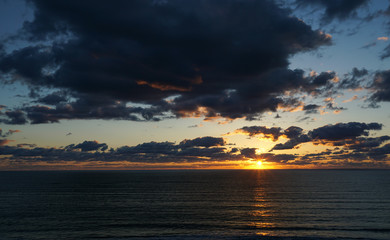 Fototapeta na wymiar Sunrise over the Atlantic Ocean on the beach at Hutchison Island in Florida.