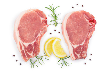 sliced raw pork meat with rosemary and lemon isolated on white background. Top view. Flat lay