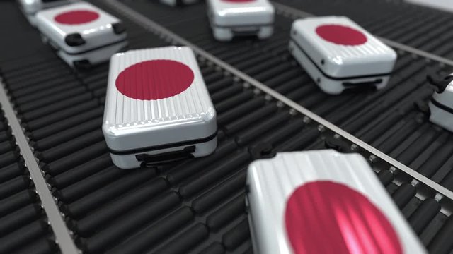 Suitcases featuring flag of Japan move on the conveyor in an airport. Japanese tourism related loopable animation