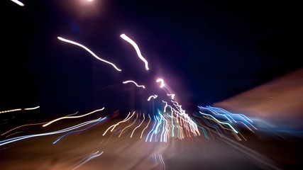 Fast car trip time lapse on the highway by night seen from the car