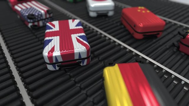 Suitcases with different state flags move on the conveyor in an airport. International tourism related loopable animation