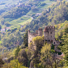Fototapeta na wymiar View on Castle Brunnenburg inside Valley and Landscape of Meran. Tirol Village, Province Bolzano, South Tyrol, Italy.