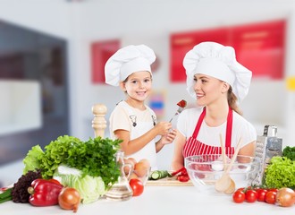 Portrait of adorable little girl preparing healthy food at kitchen