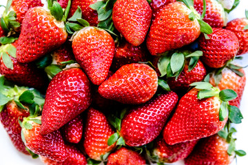 Mediterranean red strawberries shining in a kitchen.