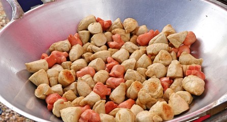 Fried meatballs and sausage at street food