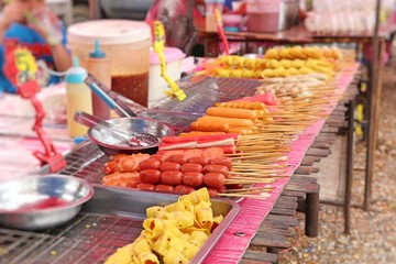 Fried meatballs and sausage at street food