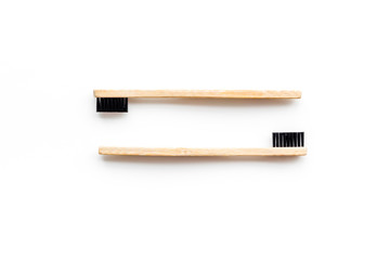 bamboo dental cleaning brush for zero waste lifestyle concept on white background top view