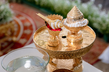 Traditional Thai Wedding ceremony atmosphere decoration and artifacts. golden tray with pedestal and the others. image for wedding objects, copy space and advertisement.