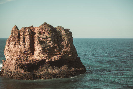 Kid Jumping Off Eagle Rock Volcanic Stack