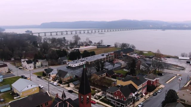 Aerial from small-town Wrightsville Pennsylvania with a view of the Susquehanna River and the Wright's Ferry Bridge, Route 30, at sunrise. Concept: winter,sunrise,new beginning,