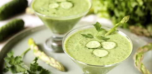 soup puree from avocado, asparagus and cucumber. Dietary detox diet. Vegetarian dish. serving soup in a glass bowl.