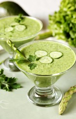 soup puree from avocado, asparagus and cucumber. Dietary detox diet. Vegetarian dish. serving soup in a glass bowl.
