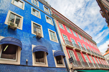 Obraz premium Lisbon, Portugal-October 17, 2018: Colorful buildings of Lisbon historic center near landmark Rossio Square