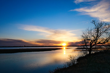 Fototapeta na wymiar Lake Bemidji, Minnesota at Mississippi River outlet at sunset.
