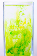 Colored green and yellow paint in the water