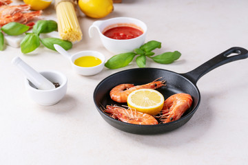 Raw ingredients for cooking: Shrimp prawns Italian spaghetti