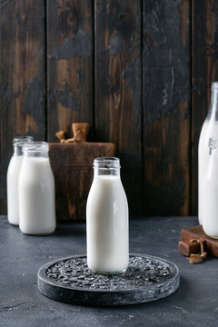 Fresh milk in different glass bottles