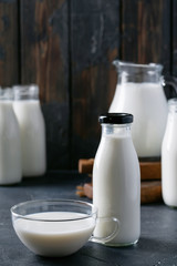 Fresh milk in different glass bottles