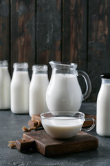 Fresh milk in different glass bottles