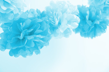 Paper flowers at the boy baby shower party. Baby shower celebration concept. Festive party background. Horizontal