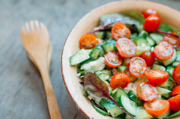 Salad bowl with tomatoes and lettuce