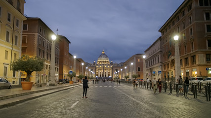 photographer takes a shot of st peters from via conciliazione, rome
