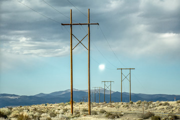 electric tower poles against the blue sky 