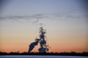 factory smoke during sunset